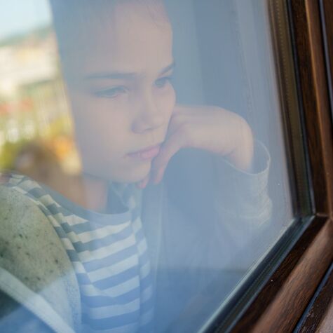 girl looking out the window