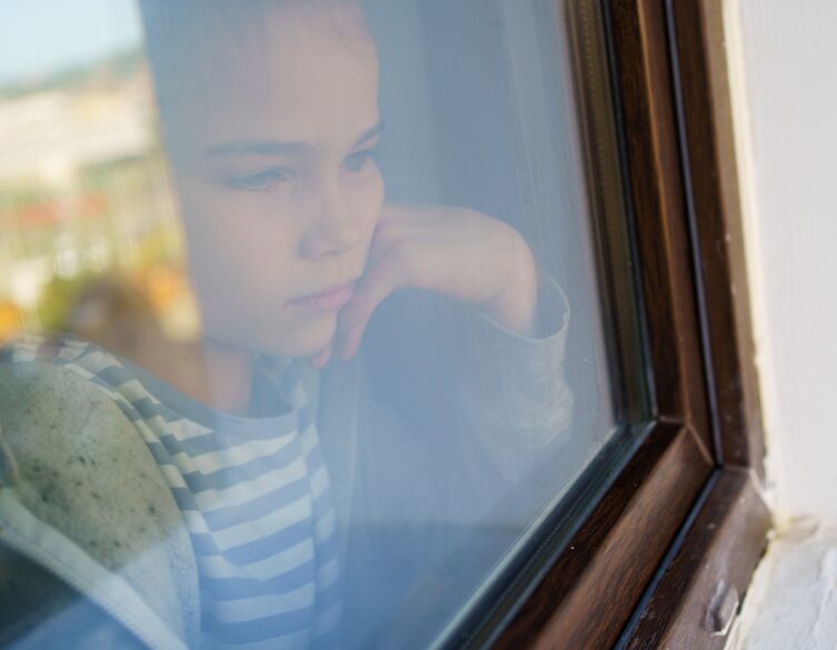 girl looking out the window