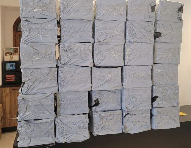 stack of white wrapped boxes on a desk