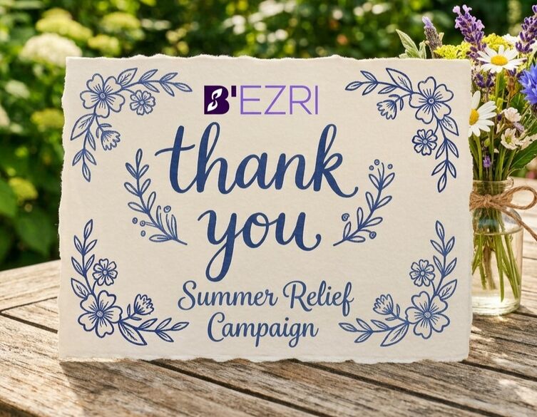 thank you card on a table with flowers next to it