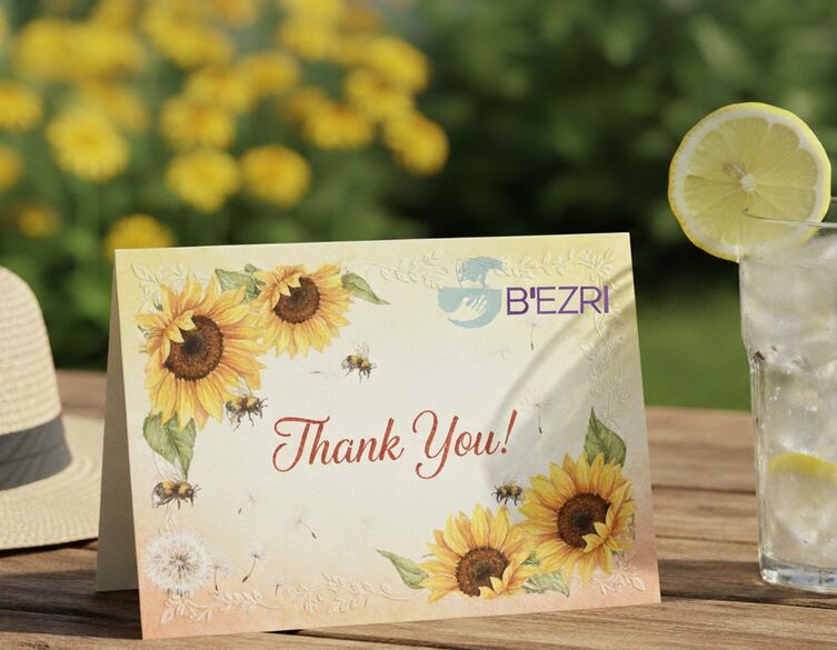 thank you note next to a glass of lemonade on a table