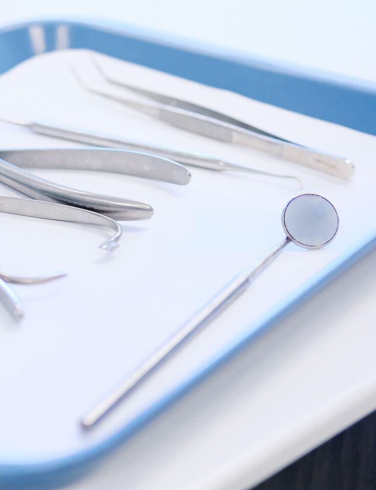 blue tray with dental tools