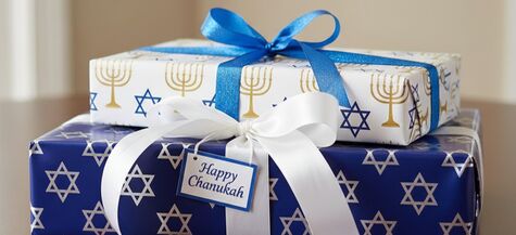 gifts wrapped in blue and white chanukah wrapping paper
